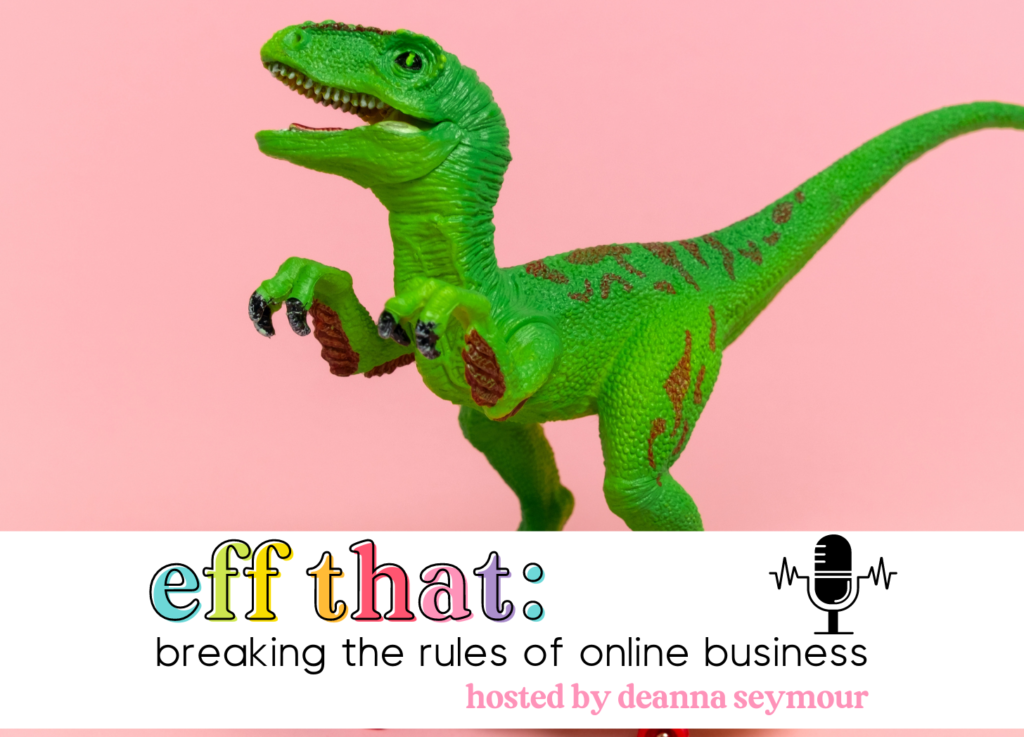 A toy T-rex stands with his little arms outstretched on a pink background. 